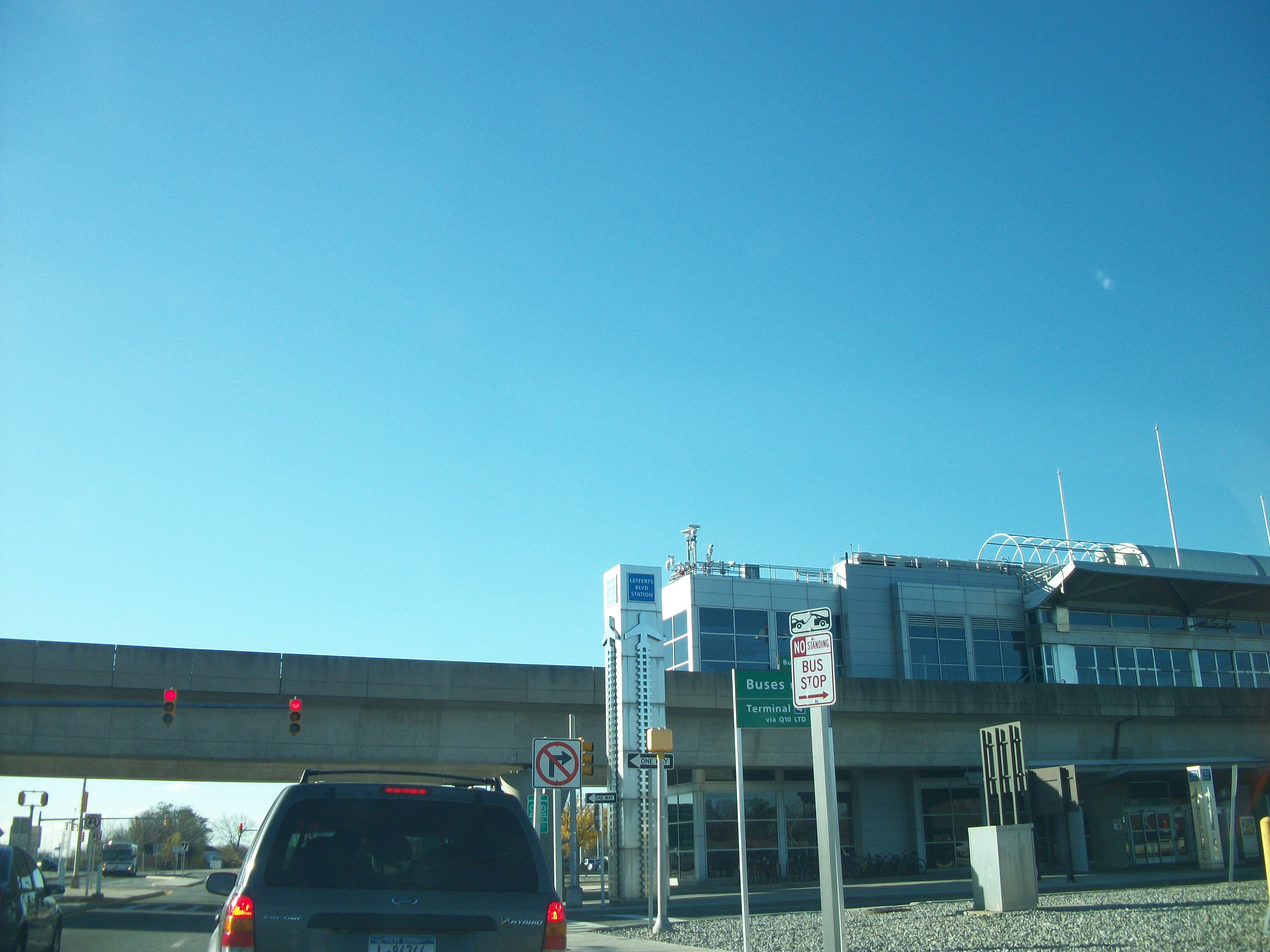 An AirTrain car pulling into an elevated station between terminals at New York's JFK airport.